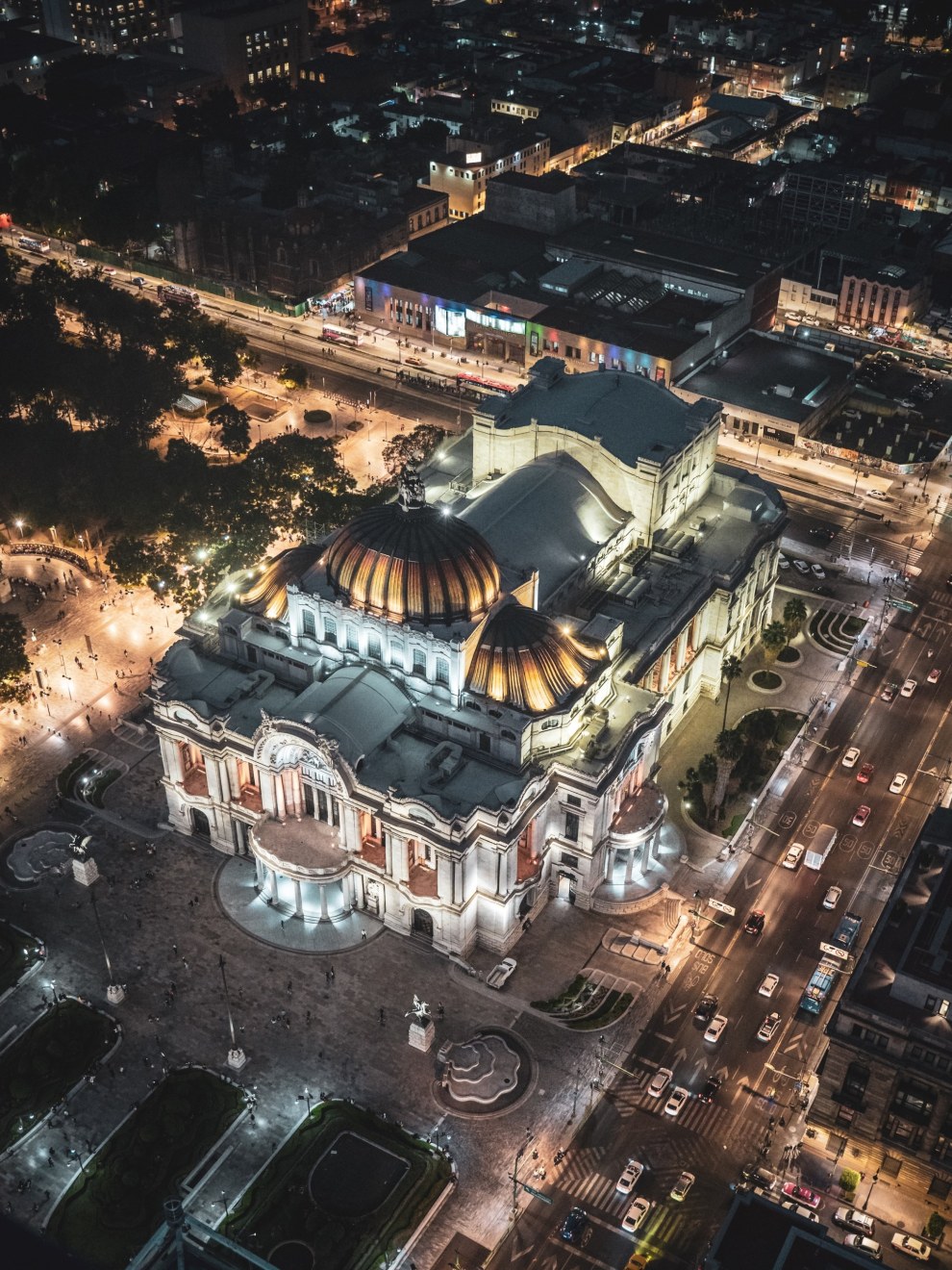 Aerial view of the illuminated Palacio de Bellas Artes and surrounding streets at night, Mexico City
