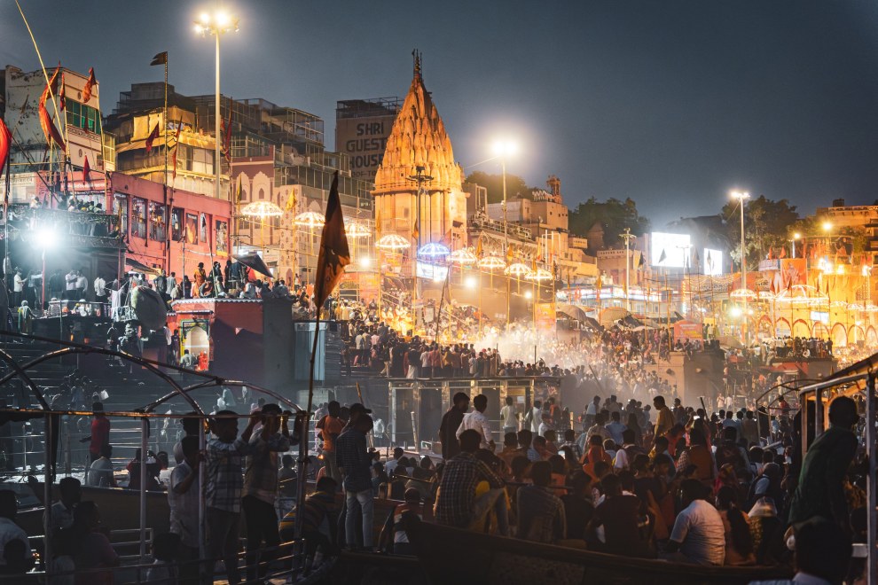 Crowds gathered on the illuminated ghats along the Ganges for the evening aarti in Varanasi, India