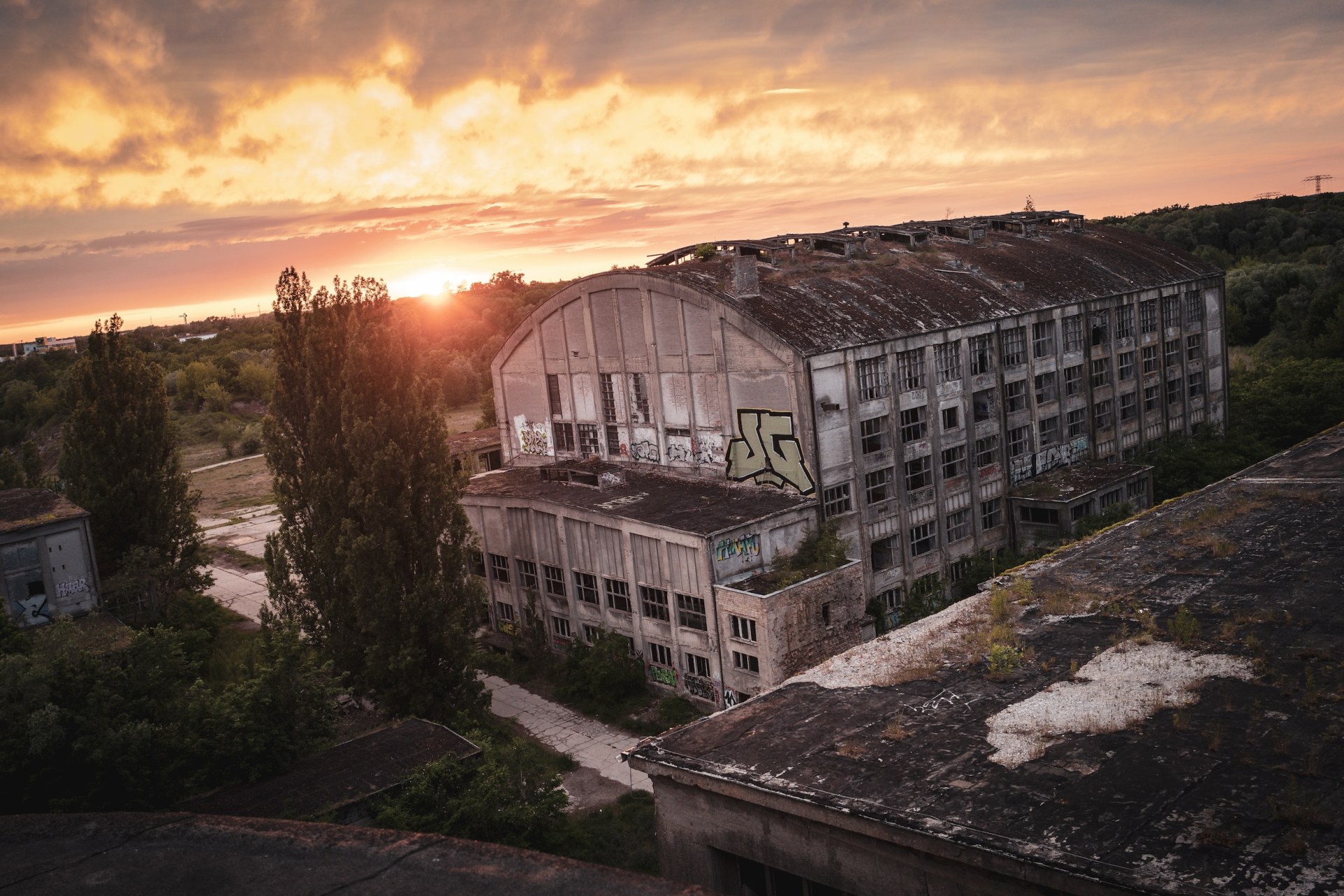 Abandoned factory hall seen from a rooftop at sunset, Rüdersdorf, Germany